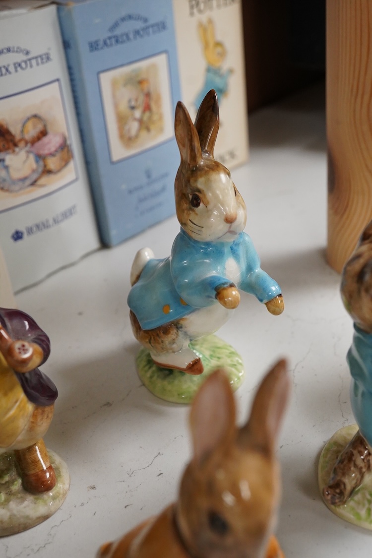 Nine Beswick Beatrix Potter figures, some stamped F. Warne & Co , largest 17cm high
